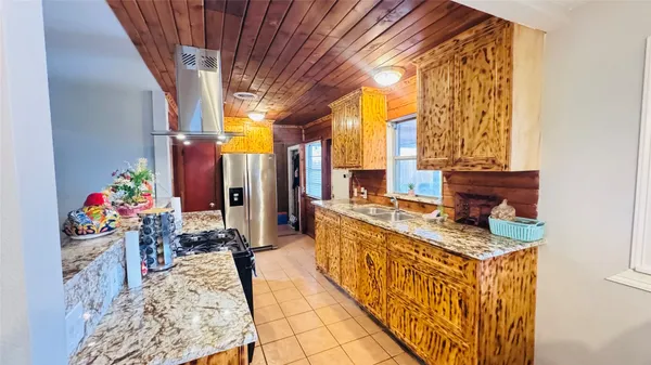 a kitchen with stainless steel appliances granite countertop a stove and a sink