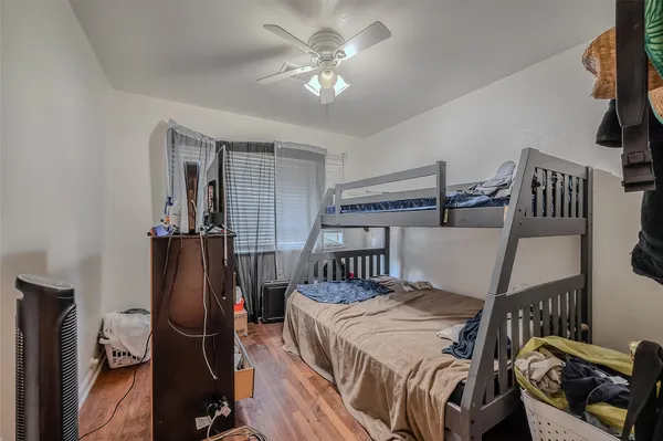 a bedroom with furniture and a chandelier