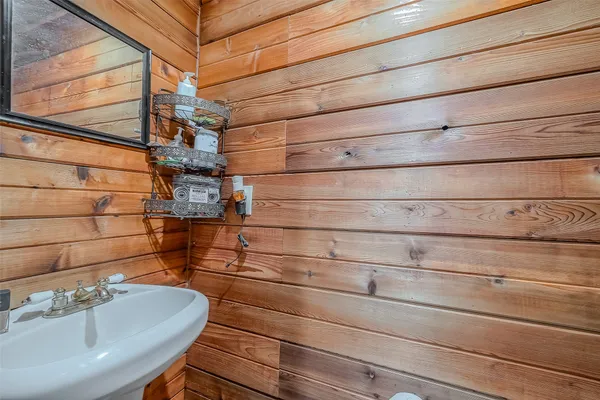 a bathroom with a sink and mirror