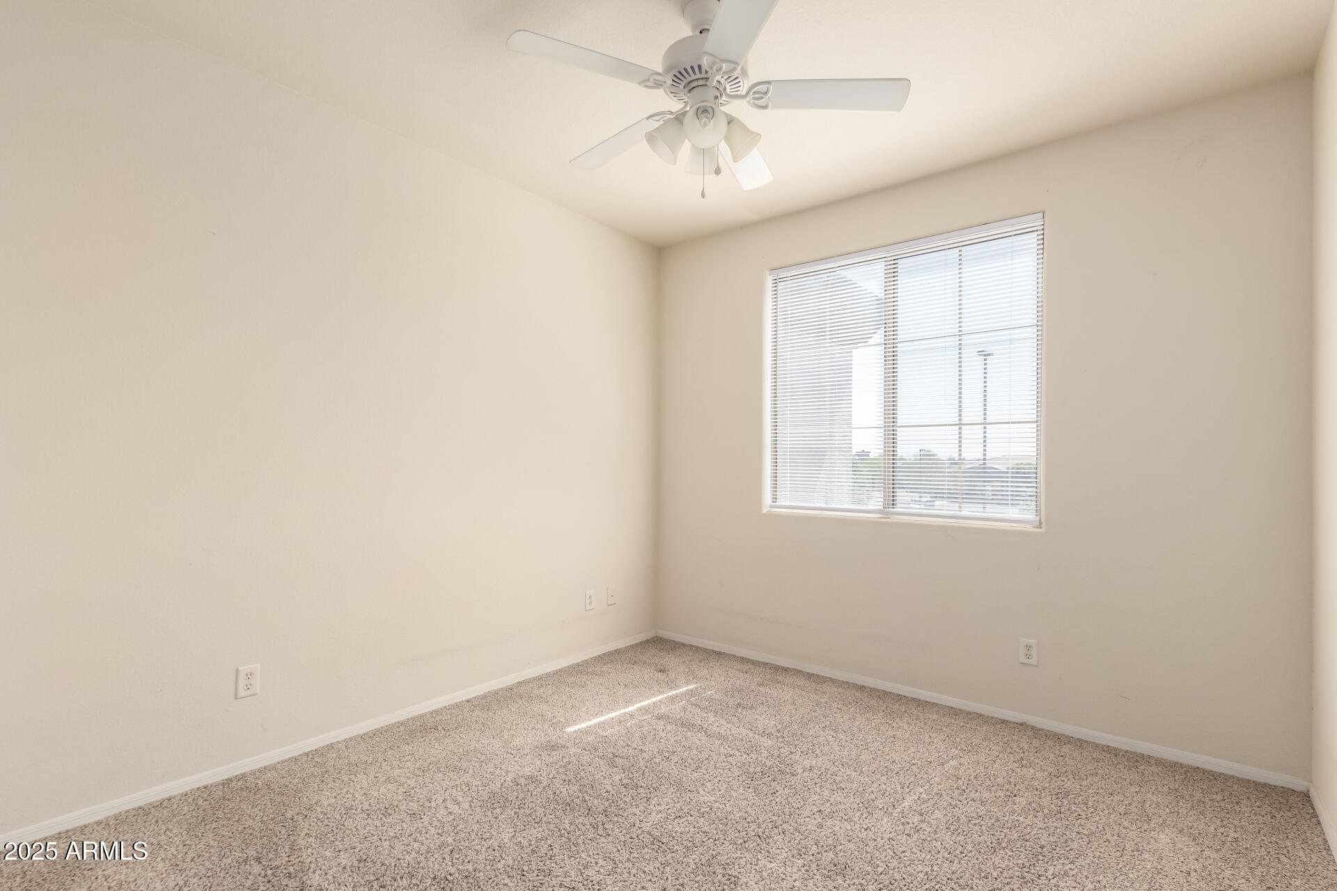1941 South Pierpont Drive, Unit 2141 Mesa, AZ 85206 - Photo 12 of 29 an empty room with a window and a fan