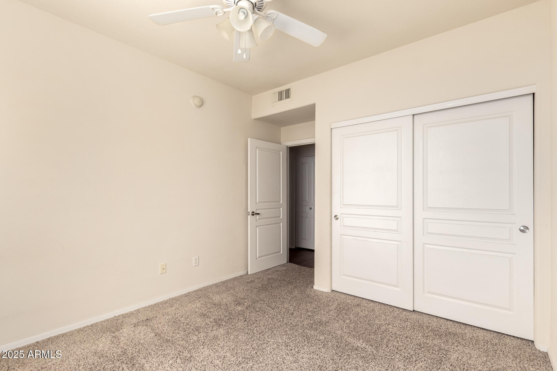 1941 South Pierpont Drive, Unit 2141 Mesa, AZ 85206 - Photo 13 of 29 an empty room with a ceiling fan