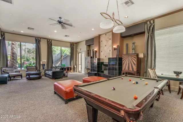 a bedroom with furniture and a flat screen tv