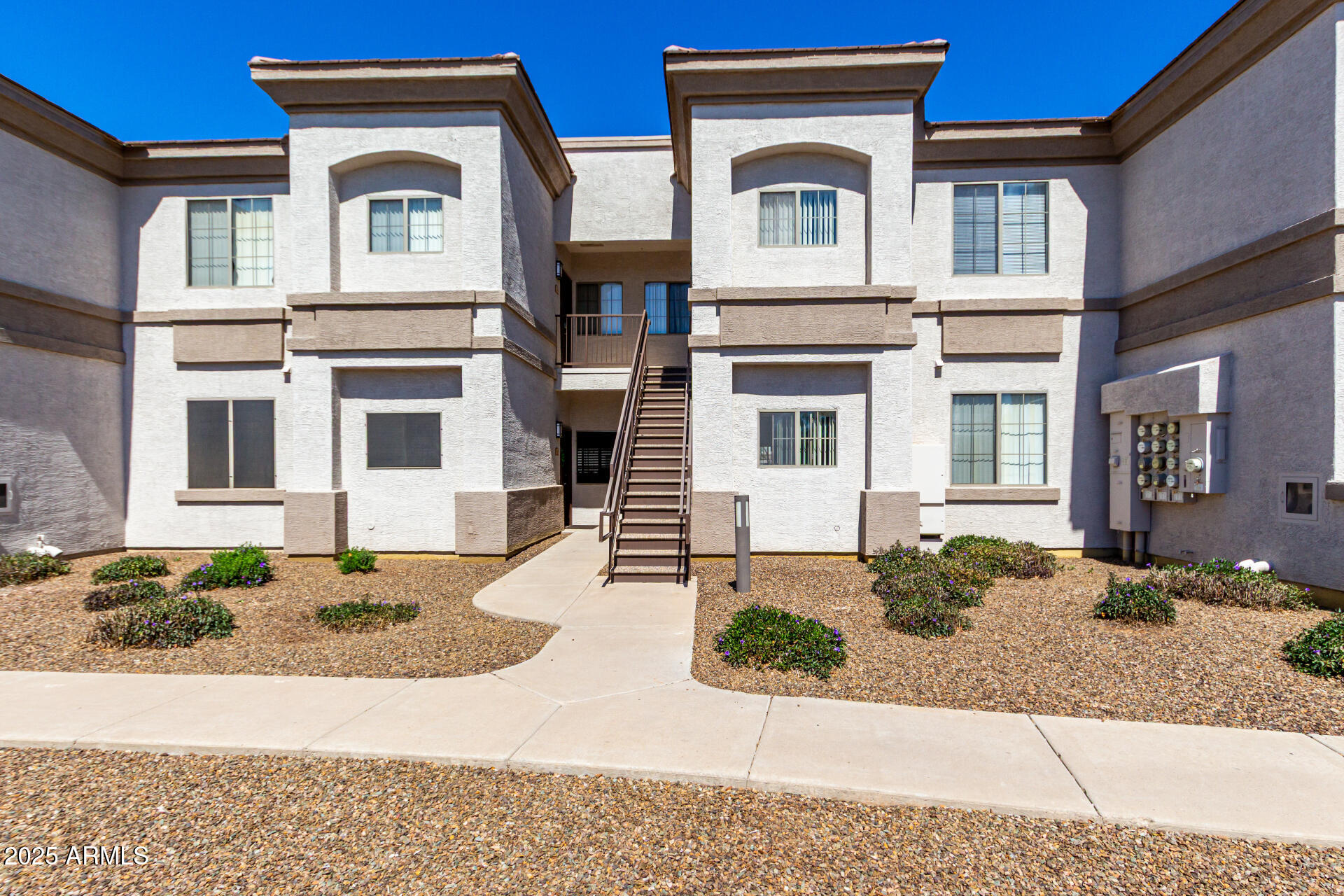1941 South Pierpont Drive, Unit 2141 Mesa, AZ 85206 - Photo 2 of 29 a front view of a house with garden