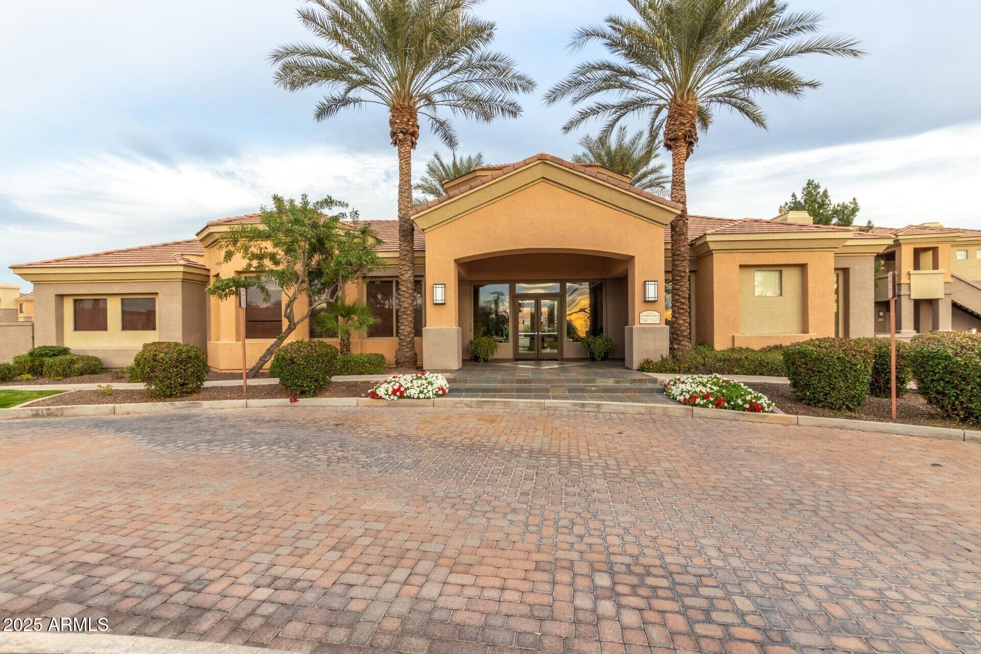 1941 South Pierpont Drive, Unit 2141 Mesa, AZ 85206 - Photo 22 of 29 a view of a house with a yard and palm trees