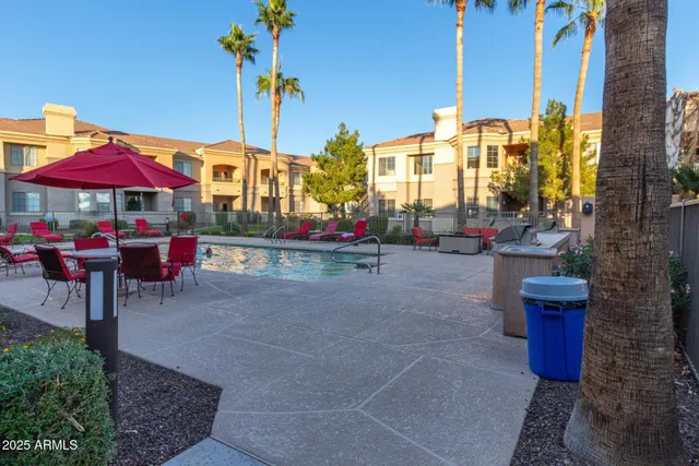 a swimming pool with outdoor seating