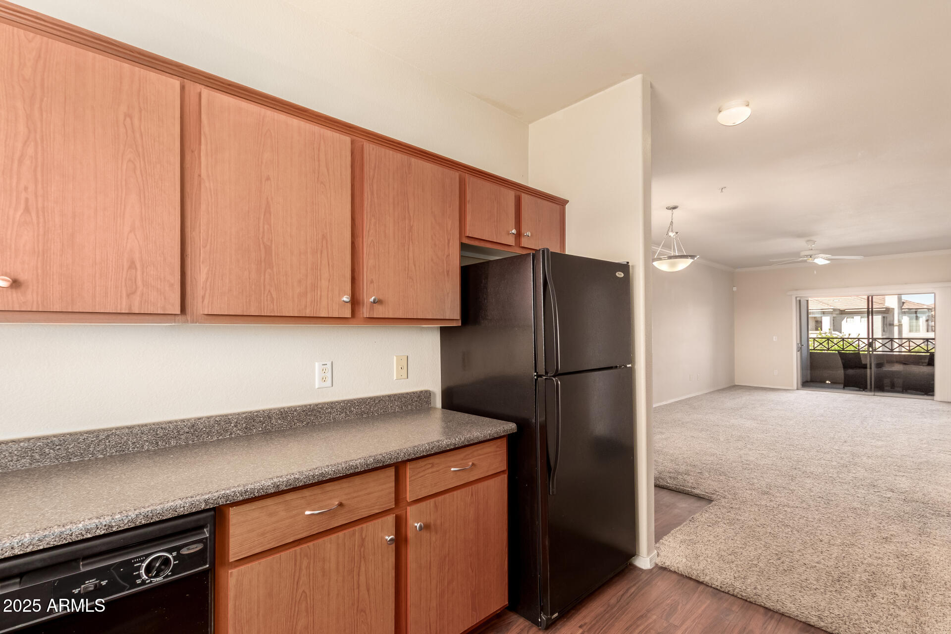 1941 South Pierpont Drive, Unit 2141 Mesa, AZ 85206 - Photo 6 of 29 a kitchen with a refrigerator and a sink