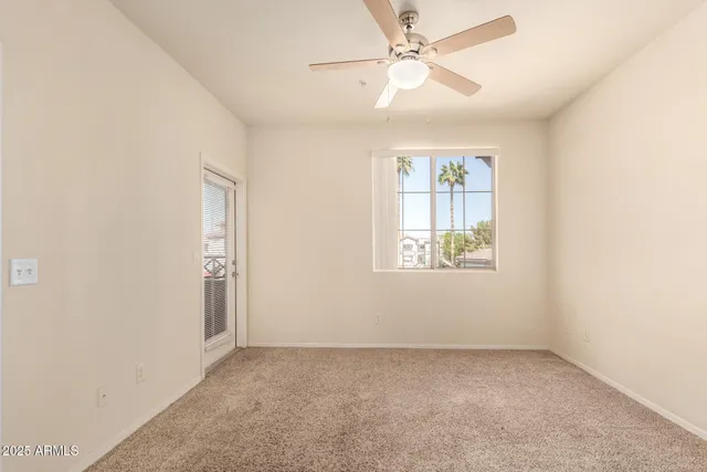 a view of a kitchen with a sink and a refrigerator