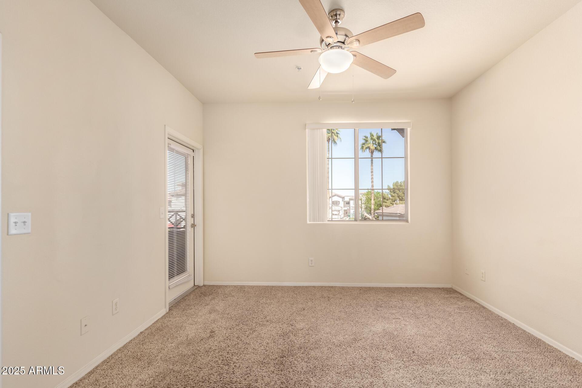1941 South Pierpont Drive, Unit 2141 Mesa, AZ 85206 - Photo 8 of 29 an empty room with windows and fan