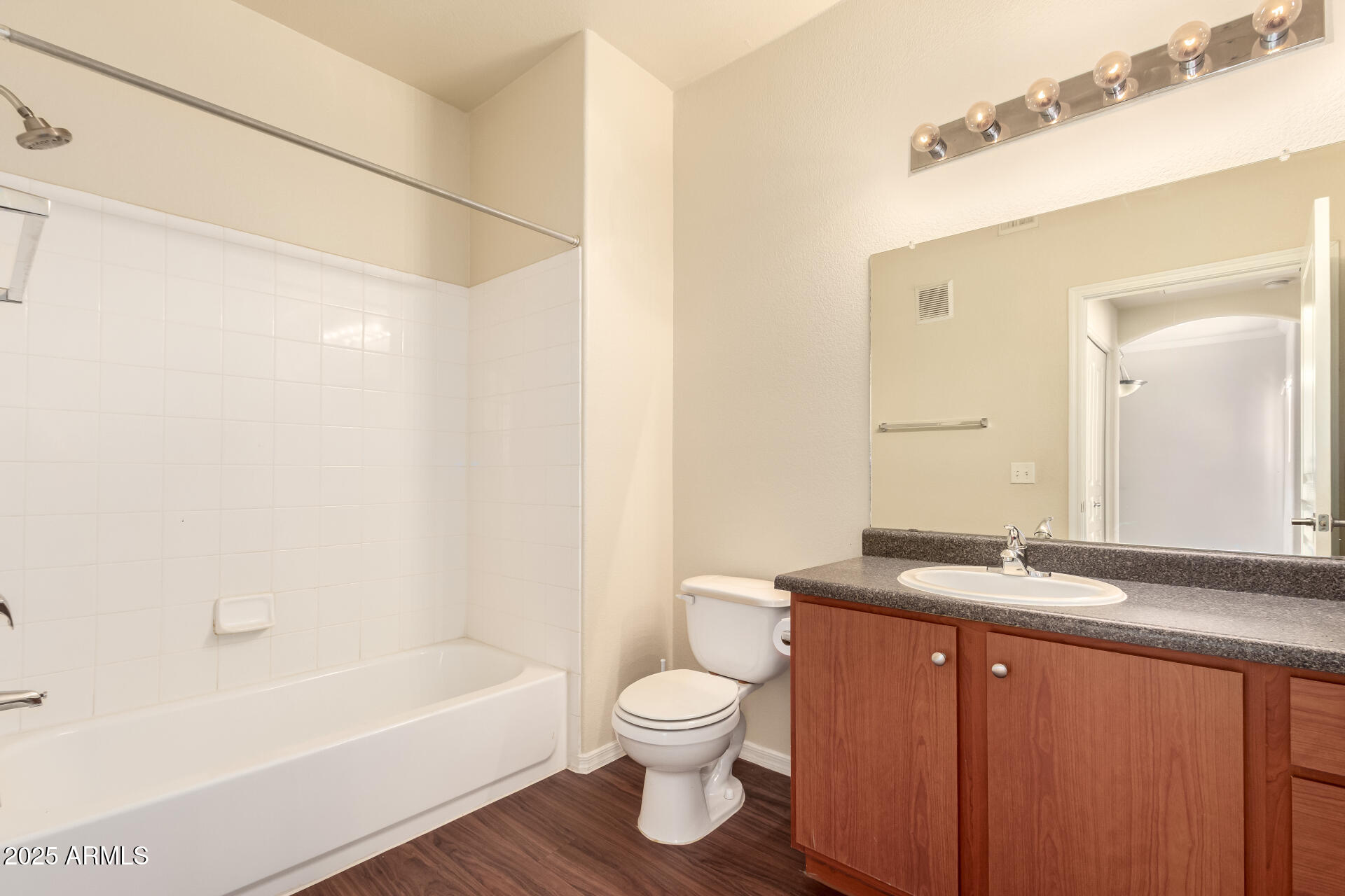 1941 South Pierpont Drive, Unit 2141 Mesa, AZ 85206 - Photo 10 of 29 a bathroom with a granite countertop sink a toilet and shower