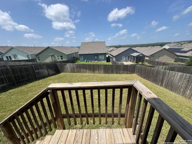 a view of a balcony with wooden floor and lake view