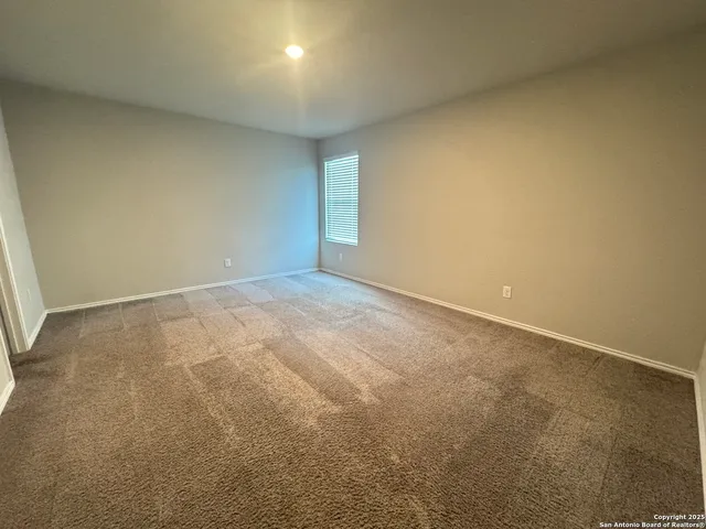 an empty room with a natural light