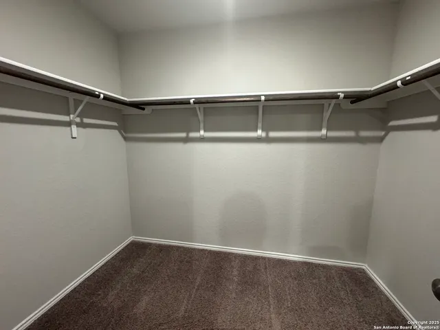a view of an empty walk in closet