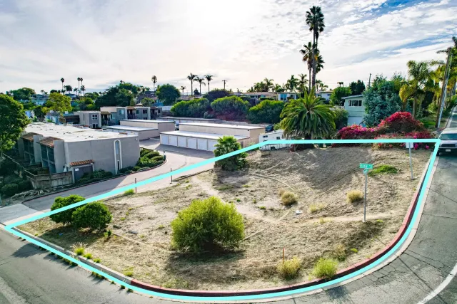 a view of a swimming pool with a yard