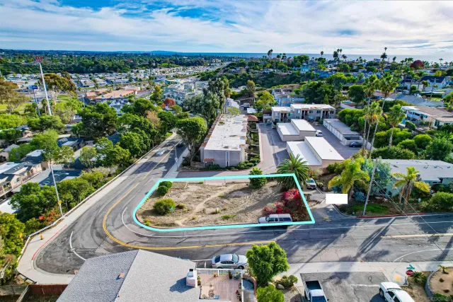 an aerial view of house with yard swimming pool and outdoor seating