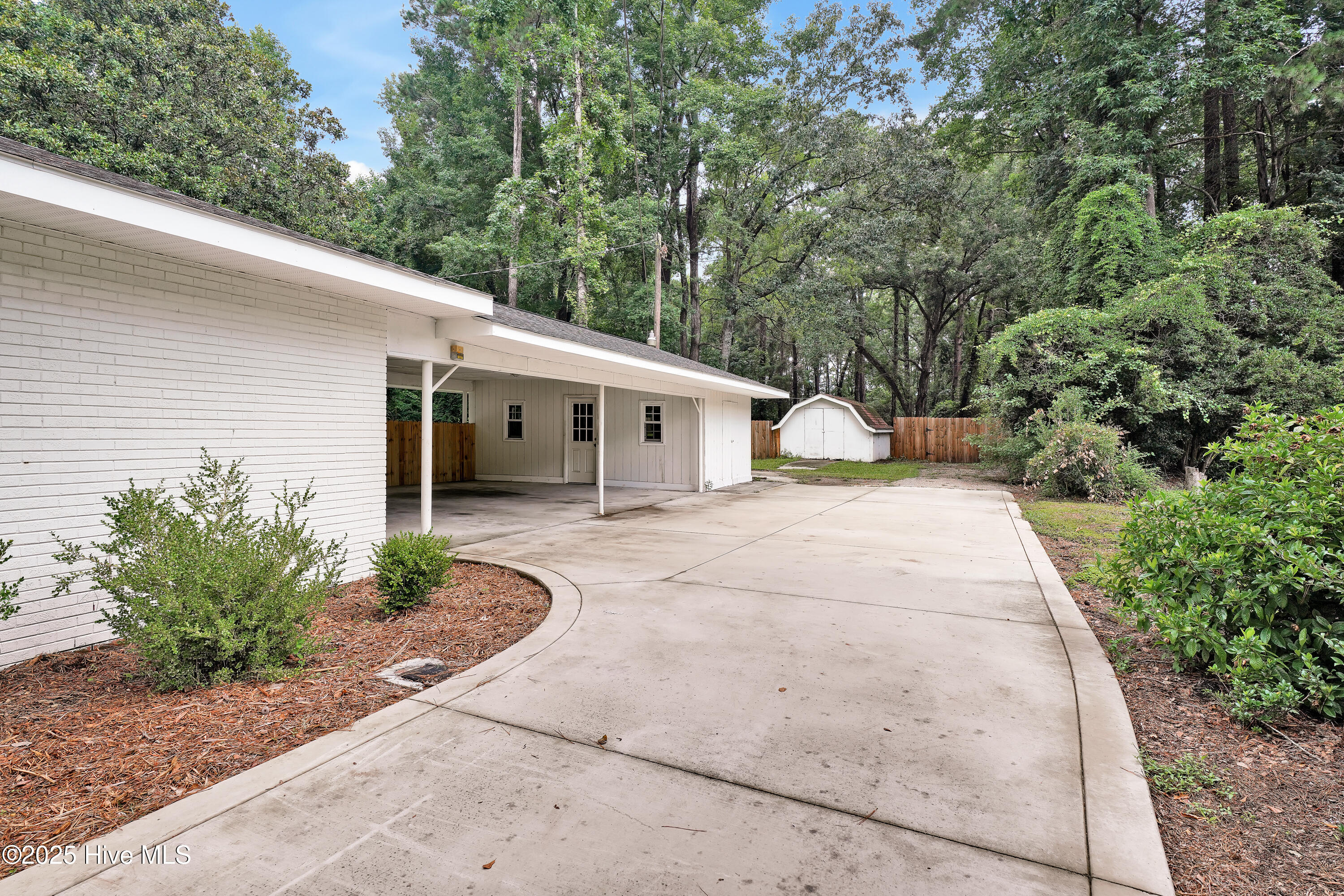354 Golf Course Road Whiteville, NC 28472 - Photo 33 of 40 Covered 2 car carport and attached storage plus detached storage shed