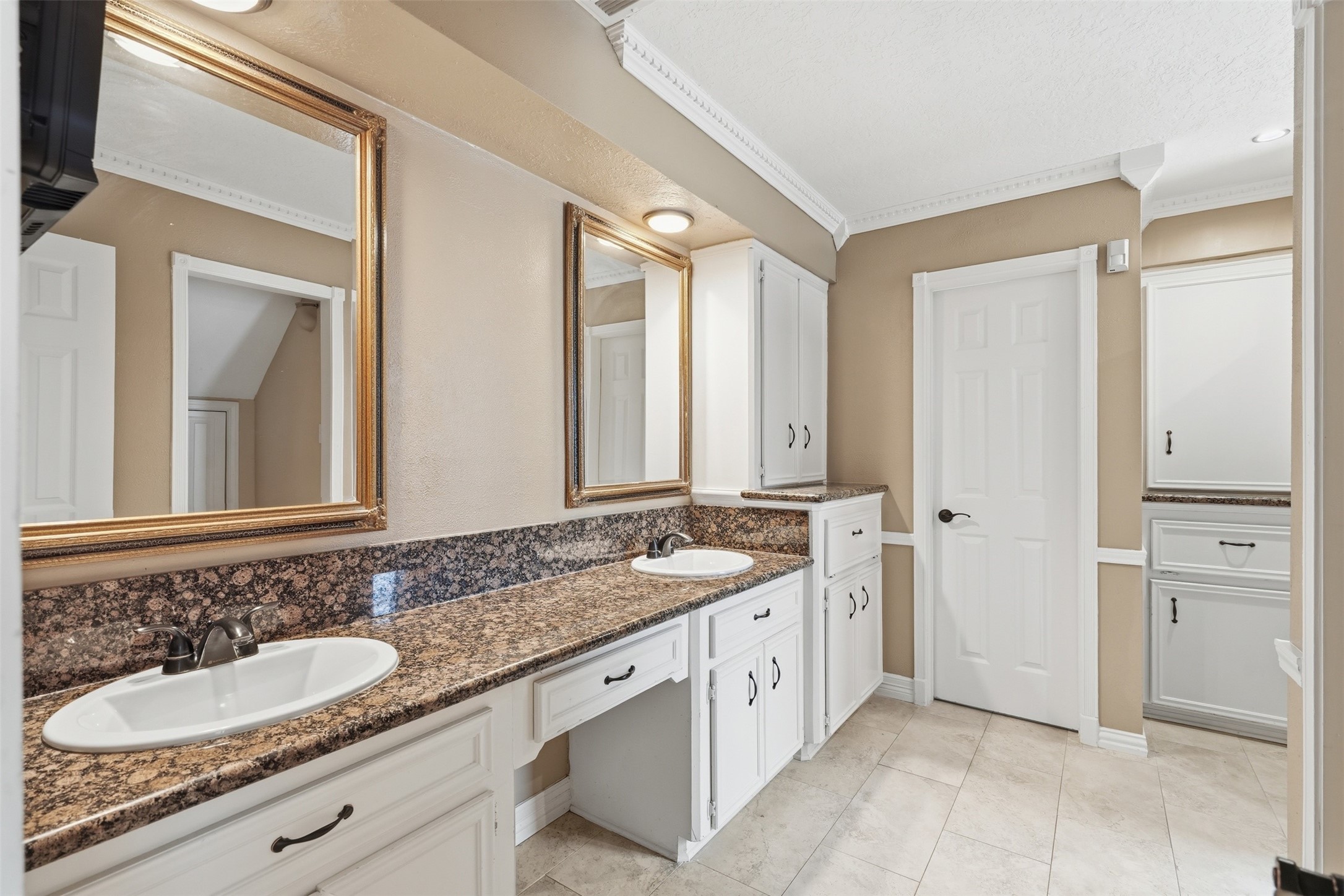 8310 Mentmore Drive Spring, TX 77379 - Photo 27 of 47 The primary bathroom features 2 sinks, elegant finishes, and a thoughtfully designed layout.