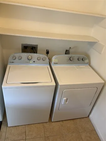 a utility room with washer and dryer