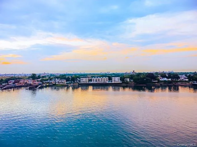 a view of a roof deck with table and chairs