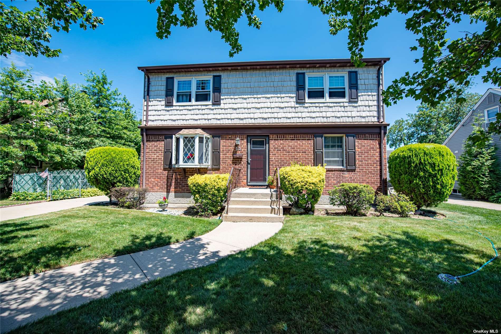 53 Linden Boulevard Hicksville, NY 11801 - Photo 1 of 1 a front view of house with yard and green space