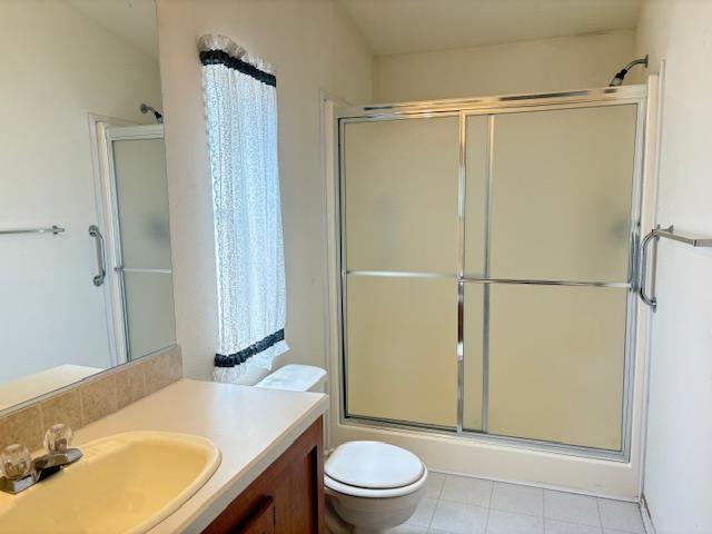 500 North Tully Road, Unit 110 Turlock, CA 95380 - Photo 11 of 17 a bathroom with a granite countertop sink toilet and shower