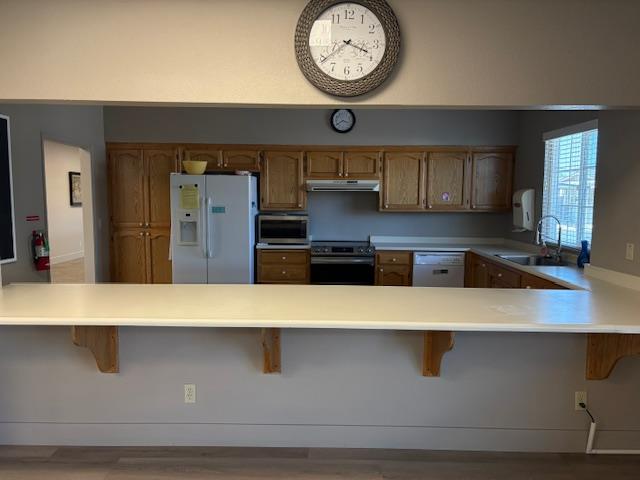 500 North Tully Road, Unit 110 Turlock, CA 95380 - Photo 16 of 17 a close view of kitchen countertops with wooden cabinet