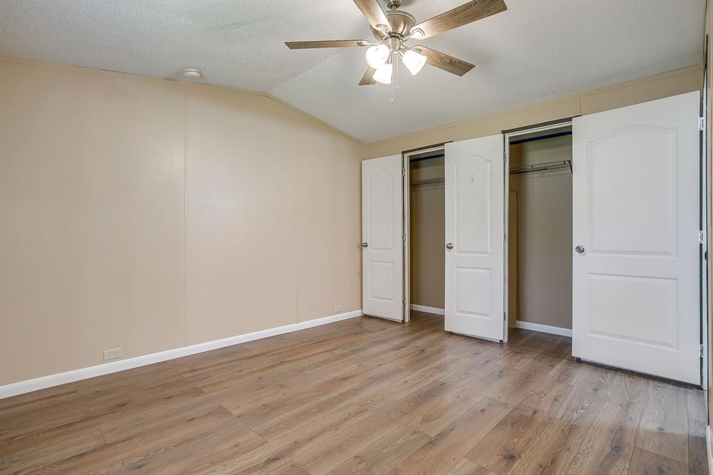 1948 Lariat Lane Burleson, TX 76028 - Photo 15 of 36 a view of an empty room with wooden floor