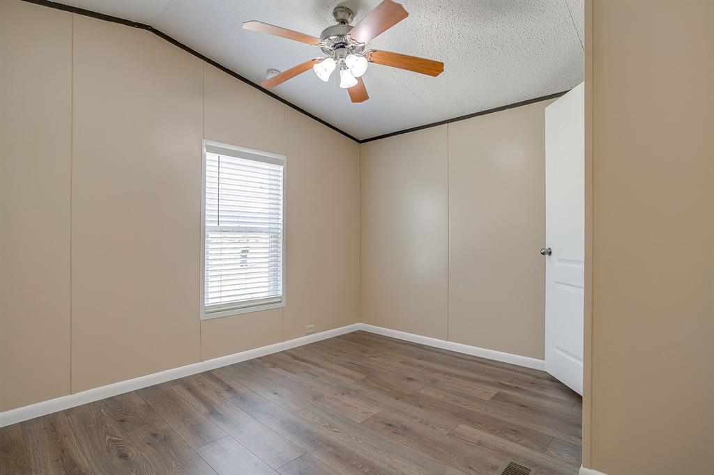 1948 Lariat Lane Burleson, TX 76028 - Photo 20 of 36 wooden floor in an empty room with a window