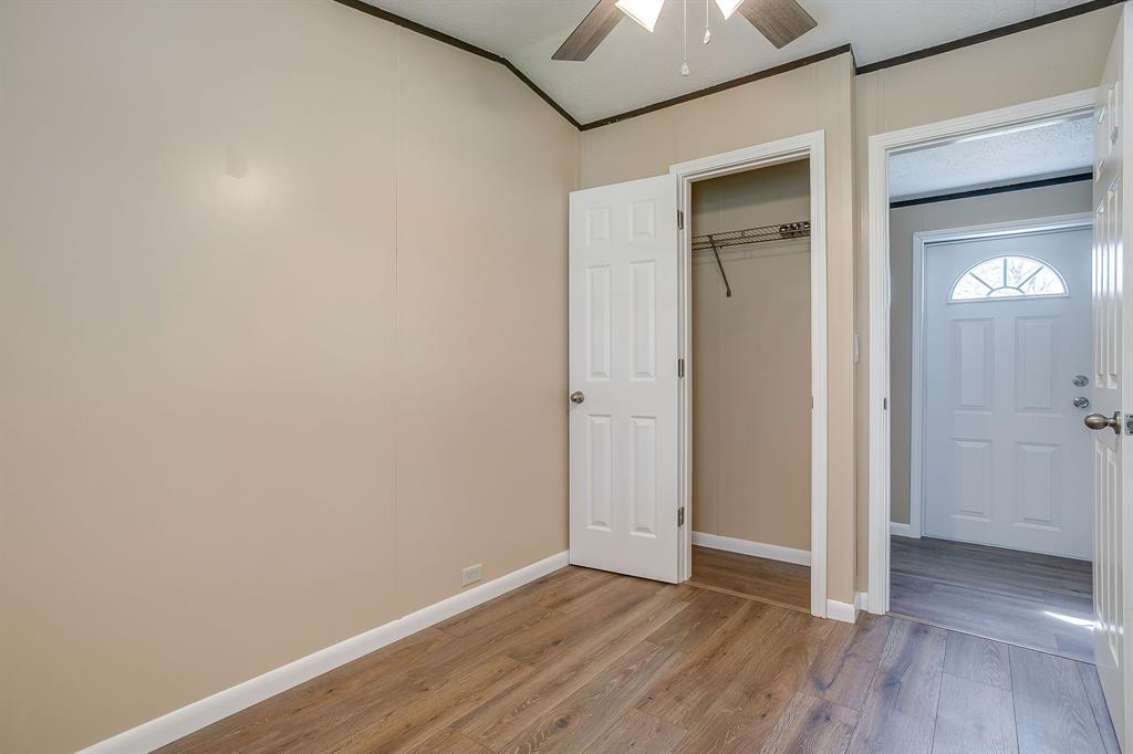 1948 Lariat Lane Burleson, TX 76028 - Photo 25 of 36 an empty room with wooden floor and windows