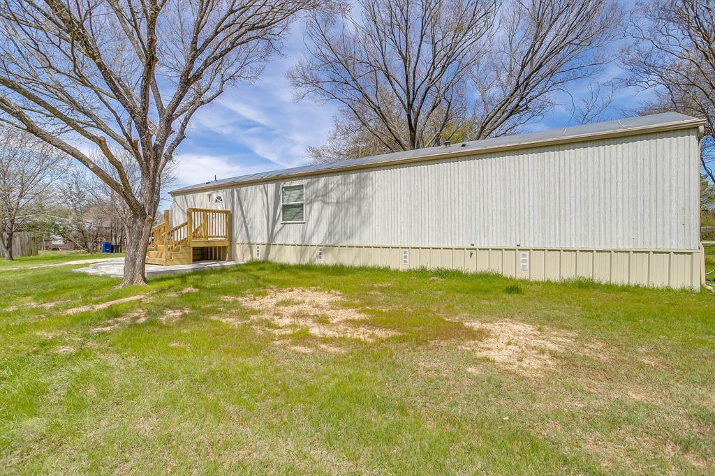 1948 Lariat Lane Burleson, TX 76028 - Photo 31 of 36 a view of a house with a yard and large trees