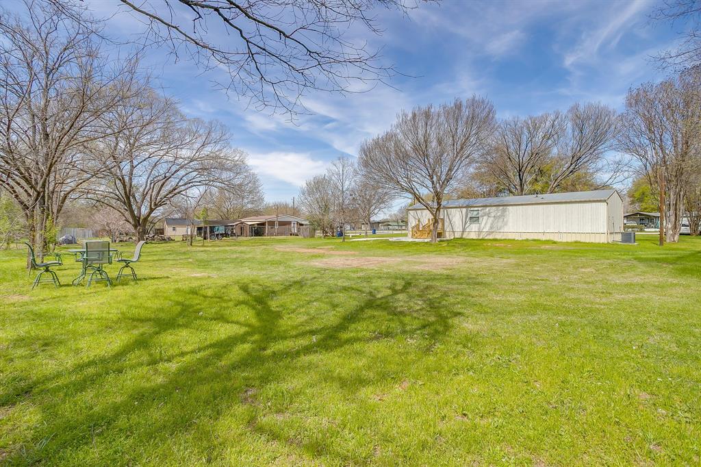 1948 Lariat Lane Burleson, TX 76028 - Photo 32 of 36 a view of a yard with a trees