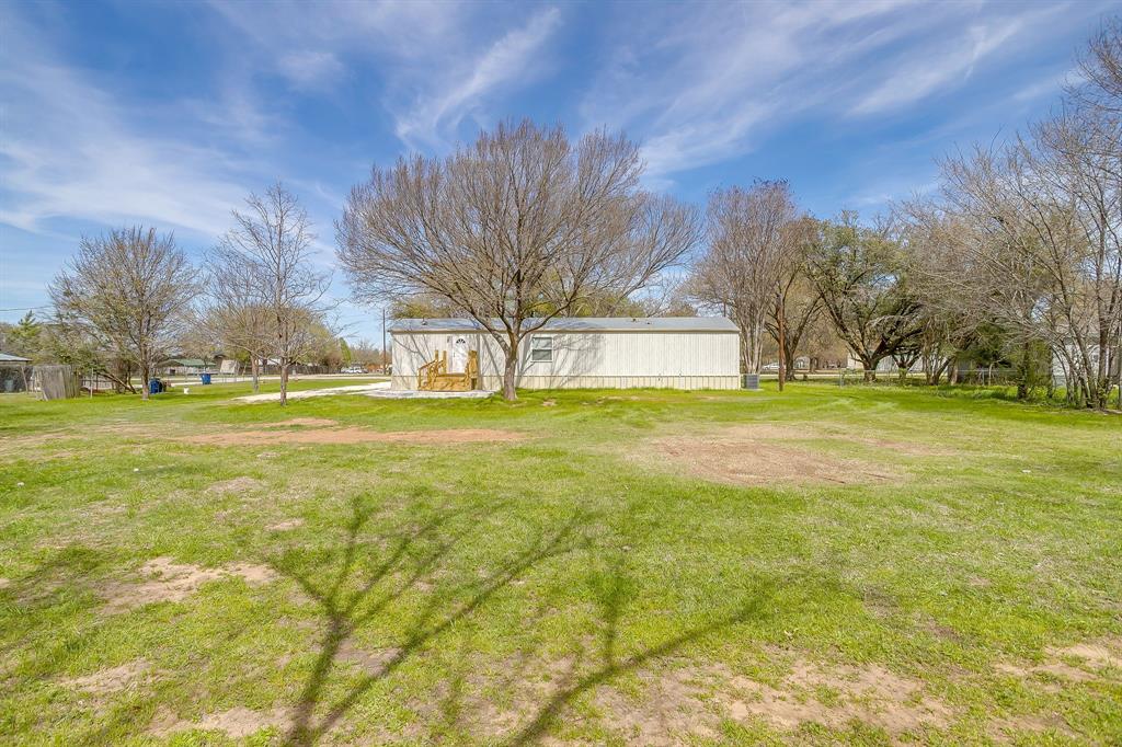 1948 Lariat Lane Burleson, TX 76028 - Photo 33 of 36 a view of the trees in front of a house