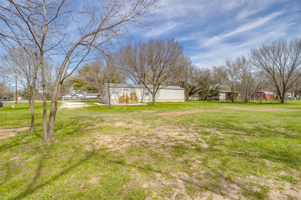 1948 Lariat Lane Burleson, TX 76028 - Photo 34 of 36 a view of a yard with swimming pool