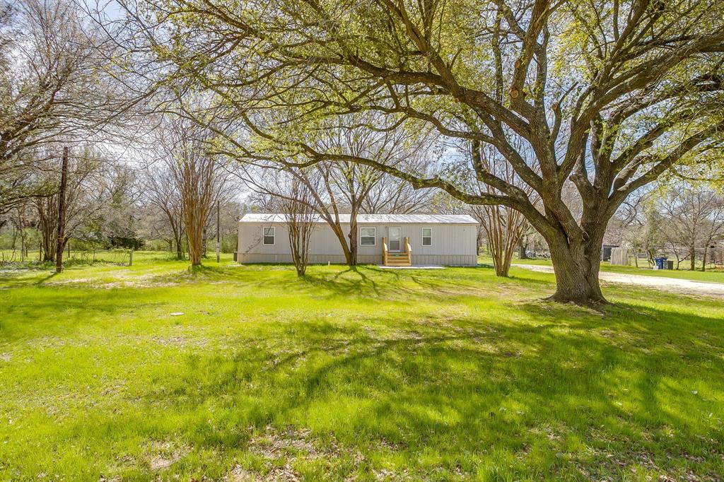 1948 Lariat Lane Burleson, TX 76028 - Photo 4 of 36 a house view with swimming pool in front of house