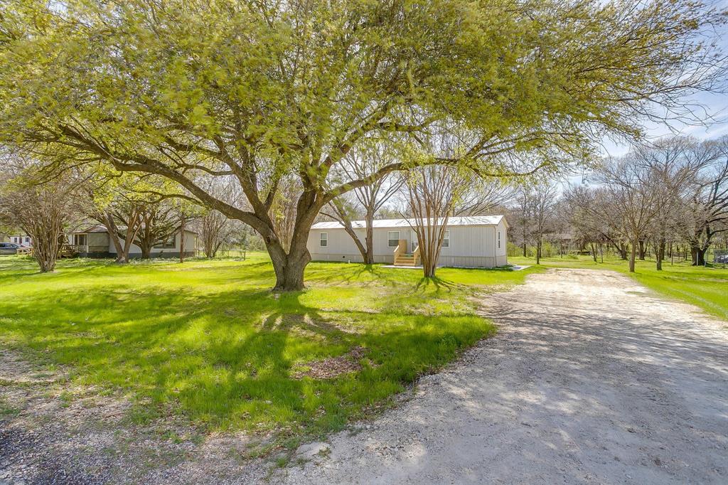 1948 Lariat Lane Burleson, TX 76028 - Photo 5 of 36 a view of yard with swimming pool