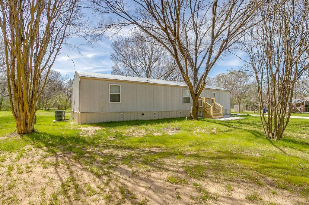 1948 Lariat Lane Burleson, TX 76028 - Photo 6 of 36 a view of a house with a yard