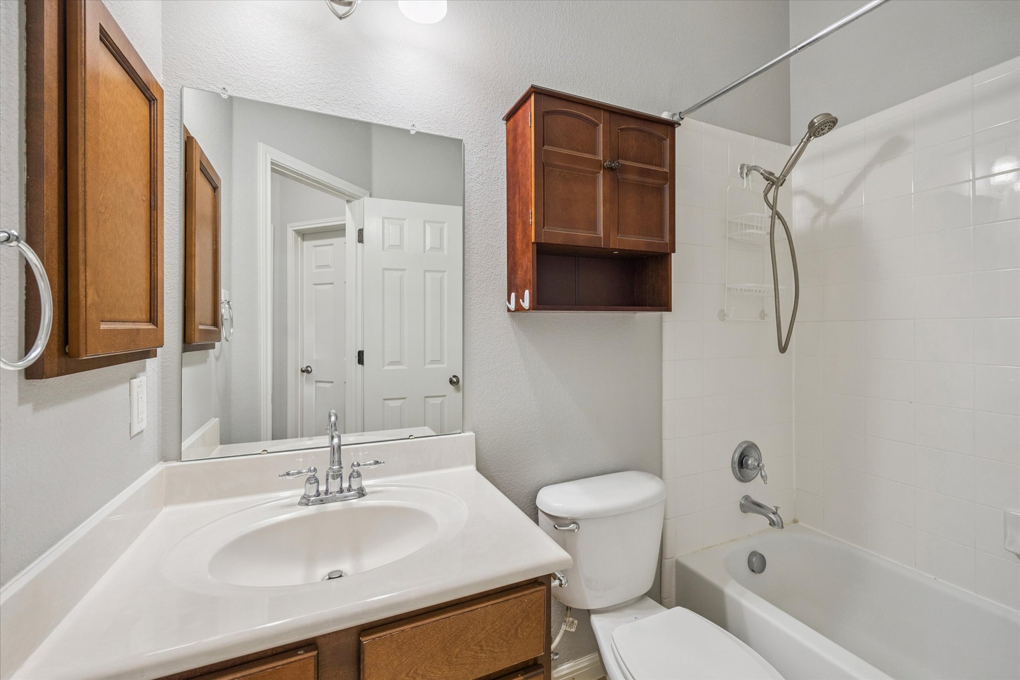 1427 Gorham Street Austin, TX 78758 - Photo 14 of 20 a bathroom with a sink toilet tub and shower