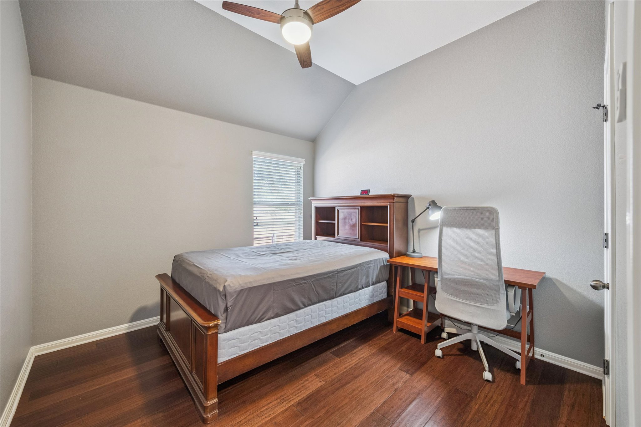 1427 Gorham Street Austin, TX 78758 - Photo 15 of 20 a bedroom with a bed and chair