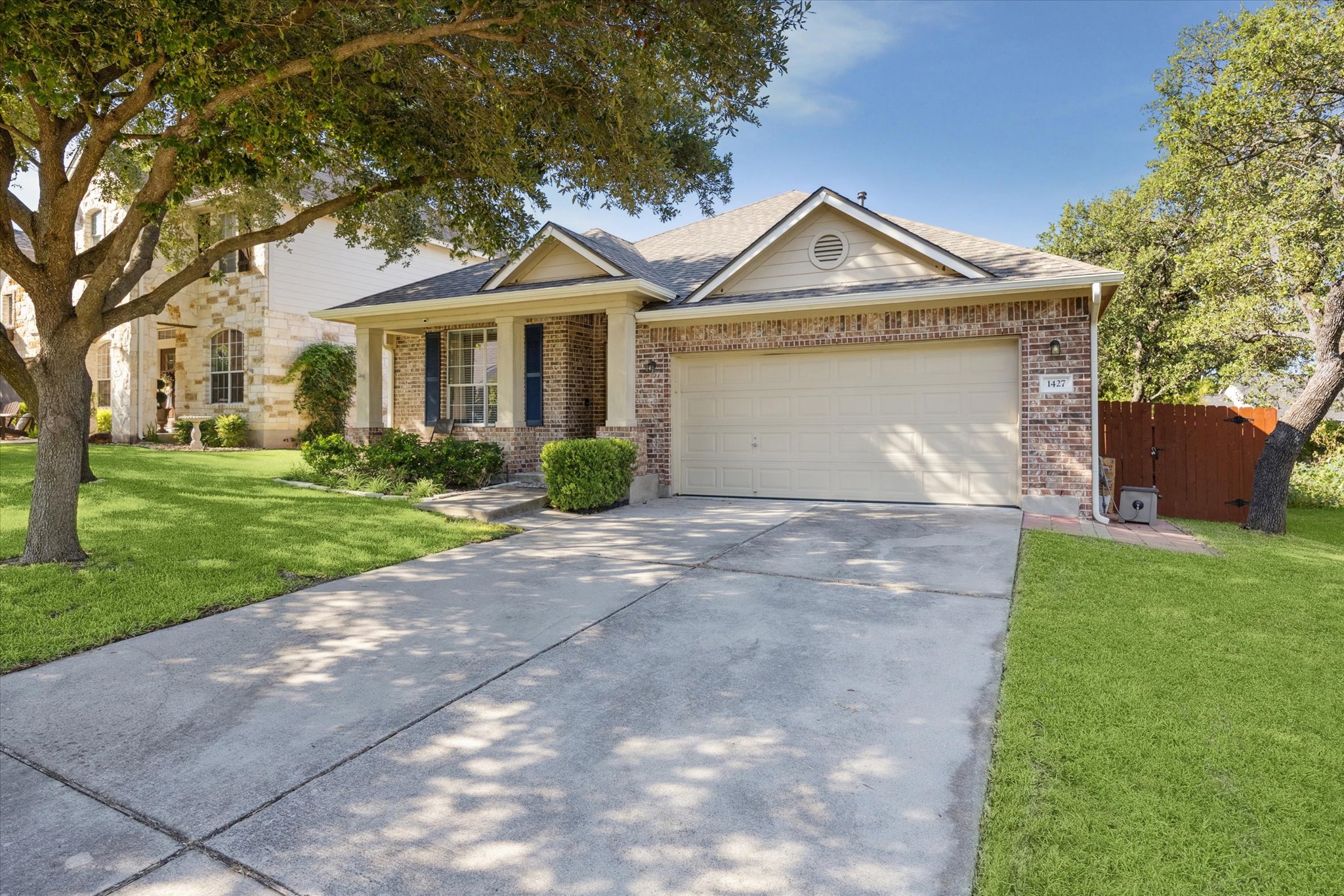 1427 Gorham Street Austin, TX 78758 - Photo 2 of 20 a front view of a house with a garden and plants