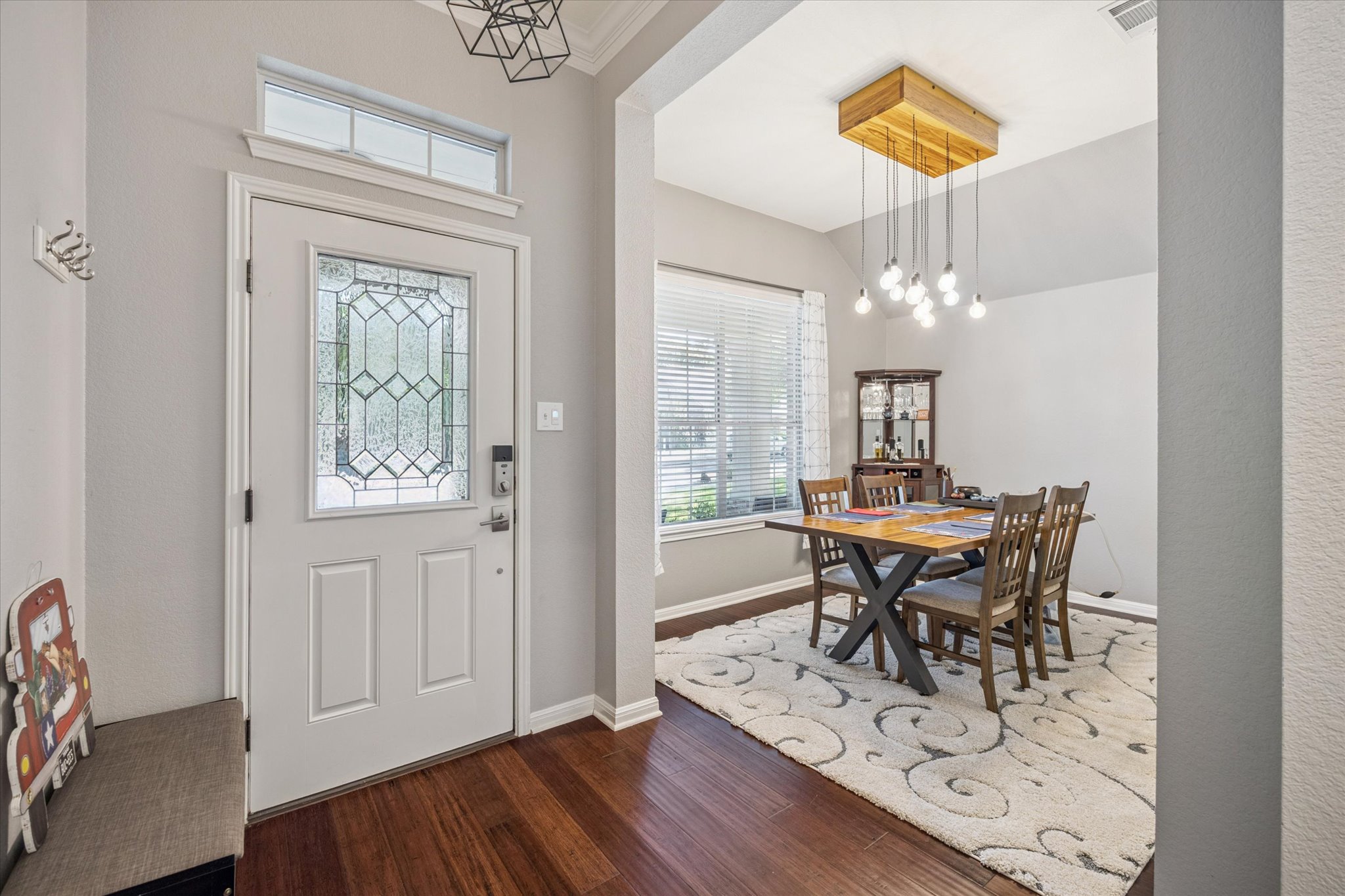 1427 Gorham Street Austin, TX 78758 - Photo 3 of 20 a view of a dining room with furniture and chandelier