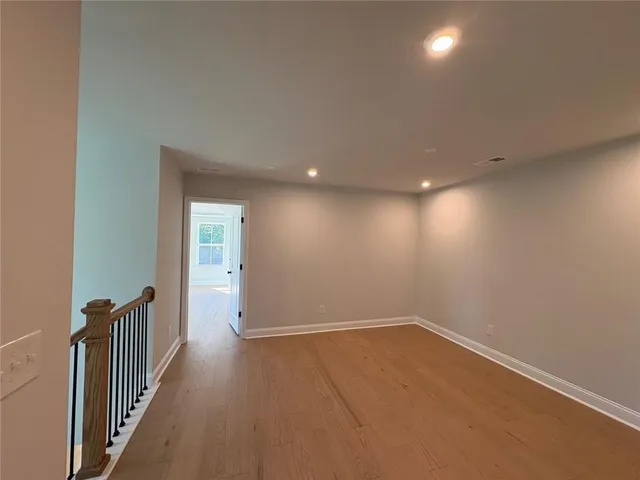 a view of livingroom with furniture wooden floor and windows