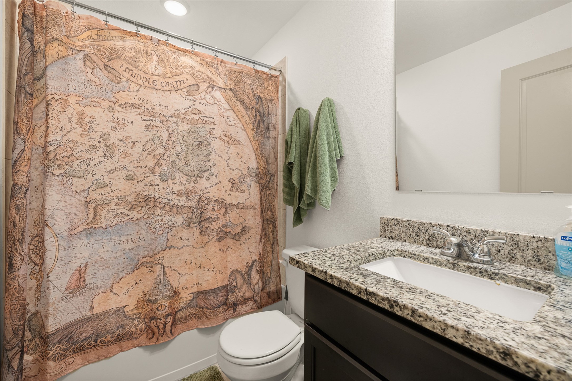 1968 Chief Street Bryan, TX 77807 - Photo 12 of 27 This bathroom features a granite countertop with a modern sink and faucet. Neutral walls and soft lighting create a cozy atmosphere.
