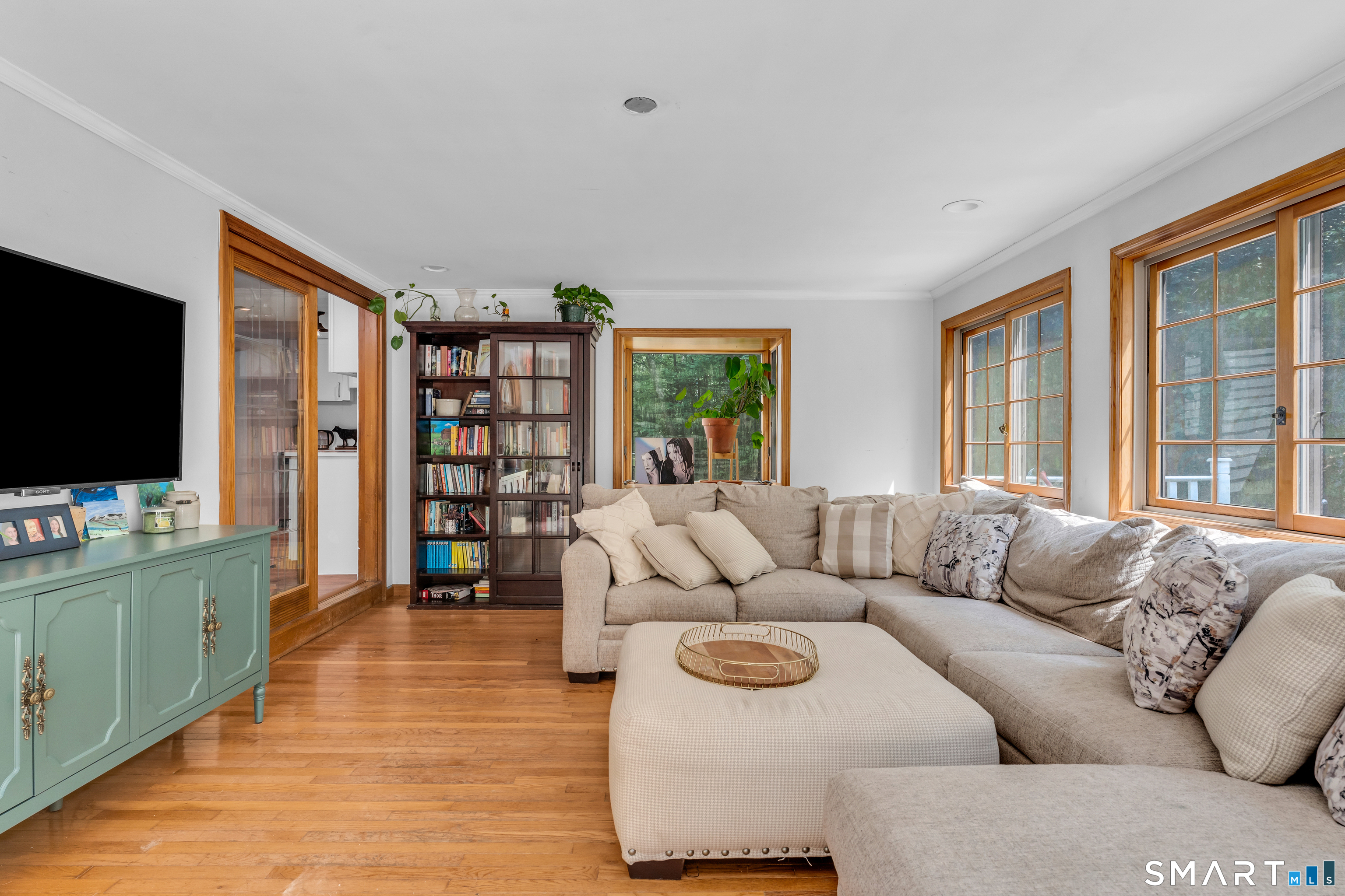 91 Whippoorwill Road Old Lyme, CT 06371 - Photo 12 of 25 The kitchen leads to the bright step-down living room