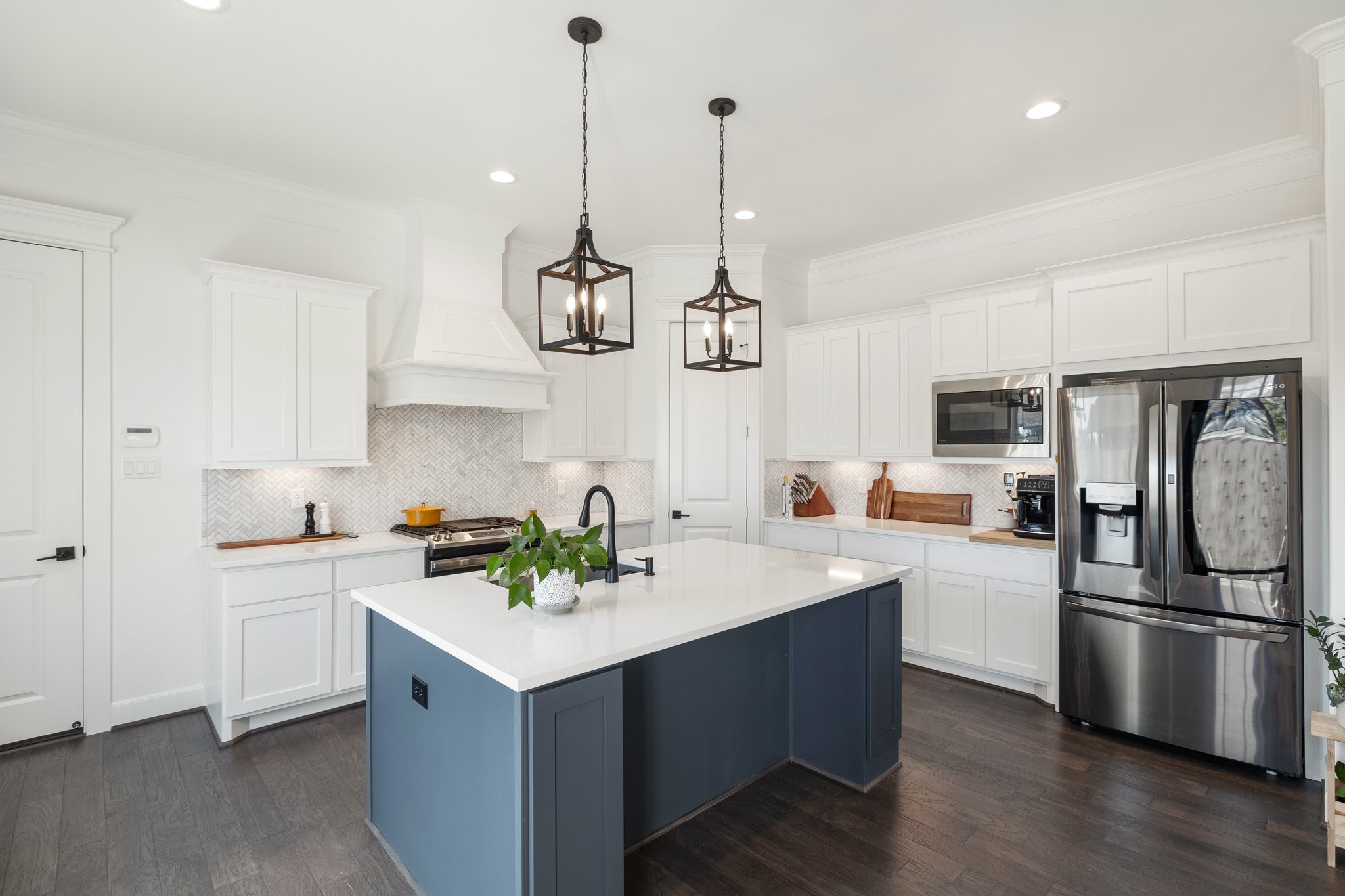817 West 19th Street Houston, TX 77008 - Photo 5 of 24 Enjoy a nice-sized pantry, tons of cabinetry, ample counter space, an oversized island, and a smart LG refrigerator.