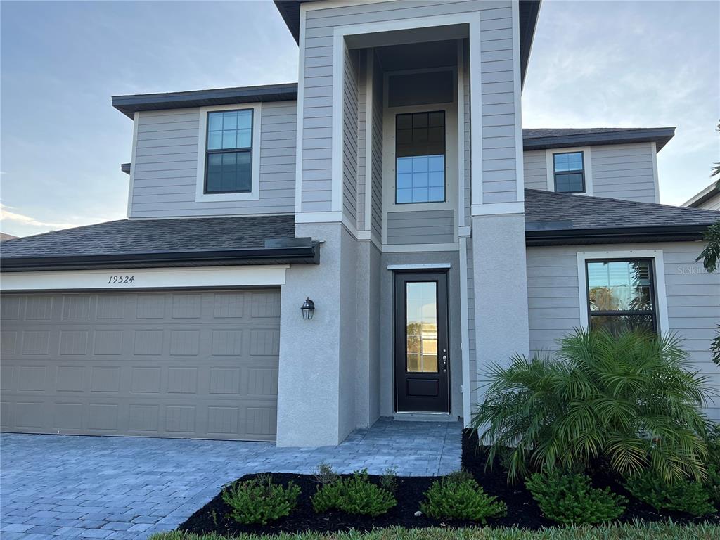 19524 Fishhawk Trail Venice, FL 34293 - Photo 1 of 30 a front view of a house with plants