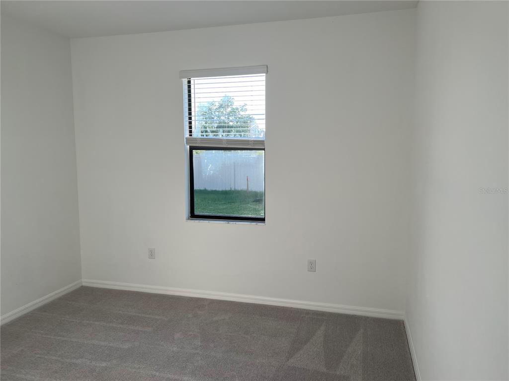 19524 Fishhawk Trail Venice, FL 34293 - Photo 11 of 30 an empty room with a window