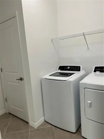 a bathroom with a granite countertop sink a toilet and bathtub
