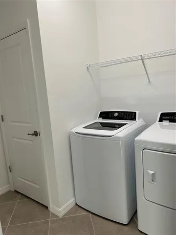 a bathroom with a granite countertop sink a toilet and bathtub