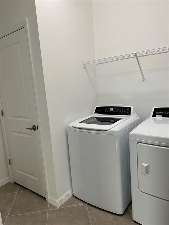 19524 Fishhawk Trail Venice, FL 34293 - Photo 12 of 30 a utility room with dryer and washer
