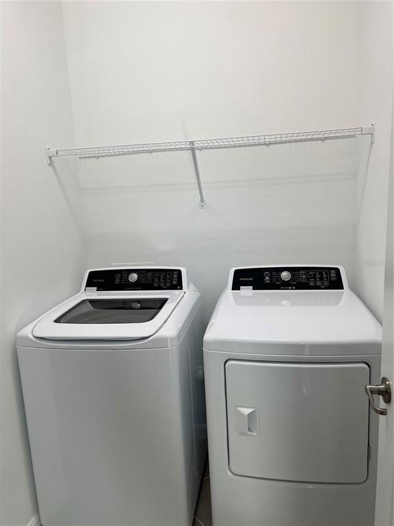 19524 Fishhawk Trail Venice, FL 34293 - Photo 16 of 30 a utility room with dryer and washer