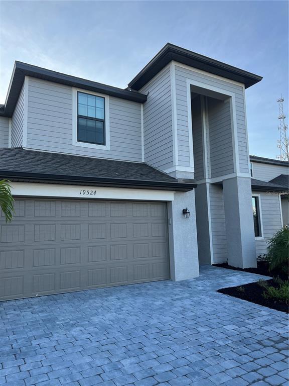 19524 Fishhawk Trail Venice, FL 34293 - Photo 3 of 30 a front view of a house with a yard and garage